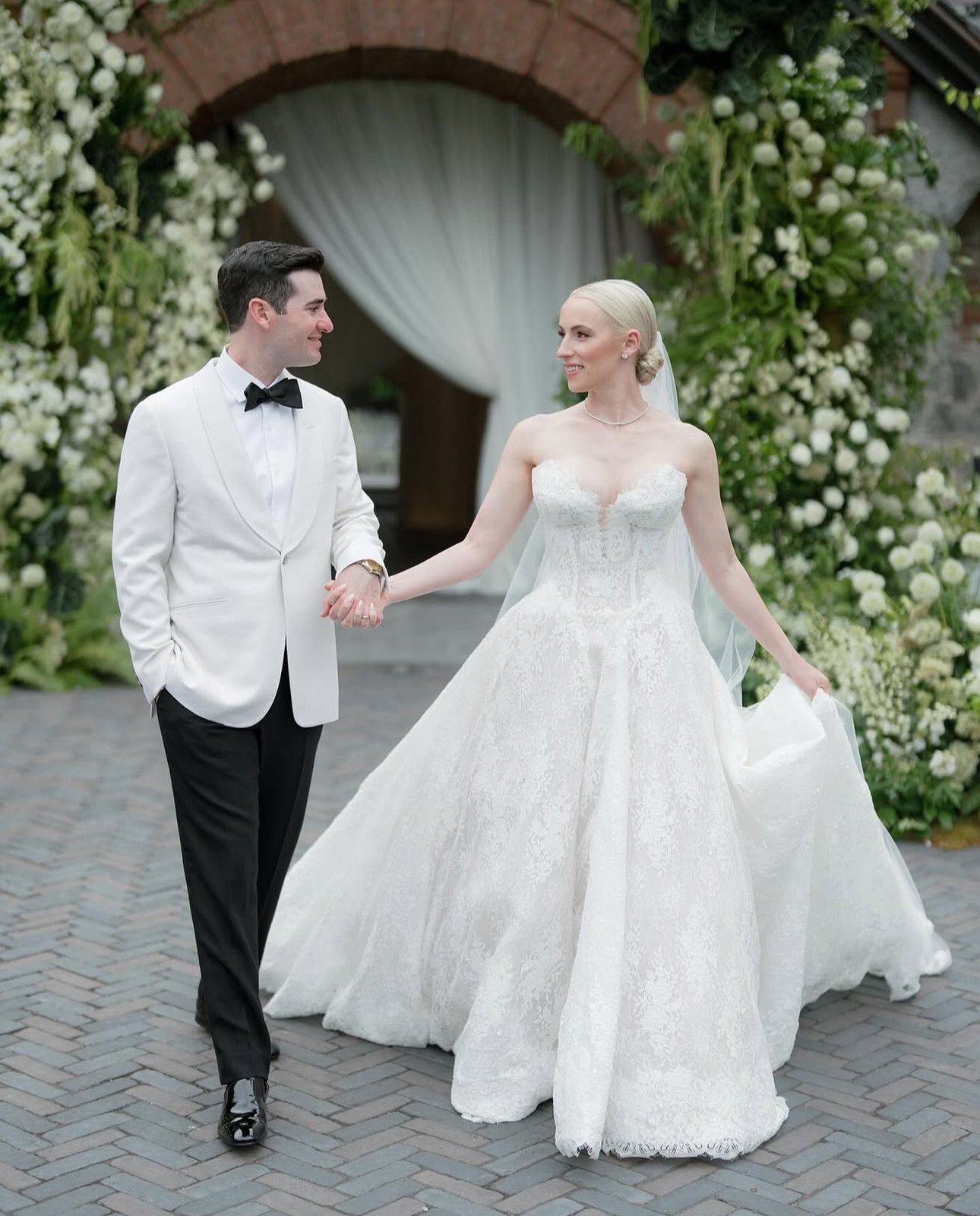 Bride and groom at the ceremony arch